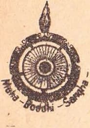 Seal of the Maha Boddhi Sangha: a many-spoked dharmachakra within a beaded ring surmounted by a flame, the legend 'Maha-Boddhi-Sangha' on a ribbon below.